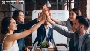 Team celebrating the achievement of a goal with high-fives
